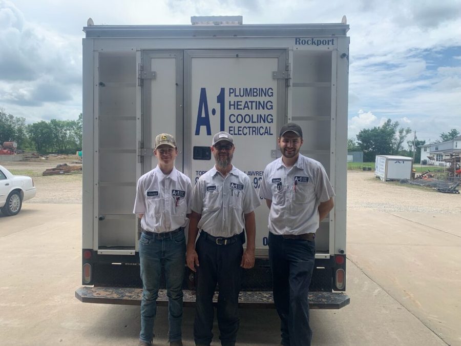 A-1 Plumbing Heating Cooling Electrical team with service truck