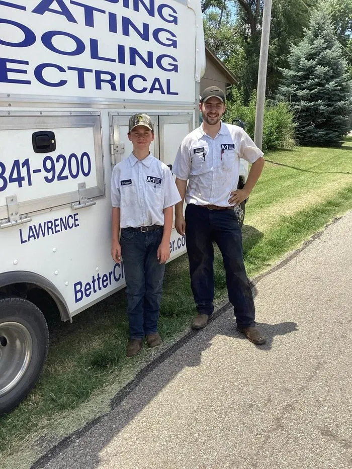 A-1 Plumbing Heating Cooling Electrical technicians with service truck