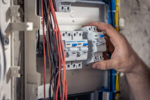 Home inspector testing home circuit breaker